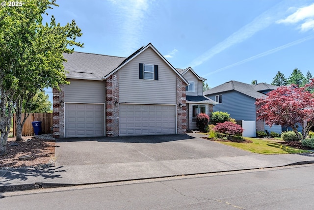 308 SW 38th Loop, Gresham, OR 97080 - traditional home with a garage, brick siding, and asphalt driveway