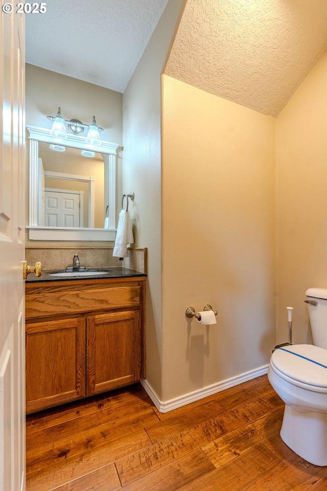 308 SW 38th Loop, Gresham, OR 97080 - bathroom featuring hardwood / wood-style flooring, a textured ceiling, and vanity