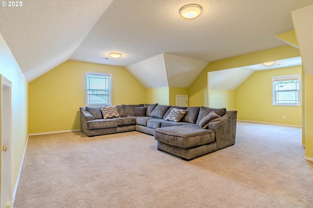 308 SW 38th Loop, Gresham, OR 97080 - carpeted living room with a textured ceiling, lofted ceiling, and healthy amount of natural light