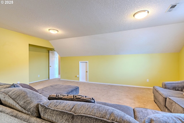 308 SW 38th Loop, Gresham, OR 97080 - living room with carpet floors, vaulted ceiling, and a textured ceiling