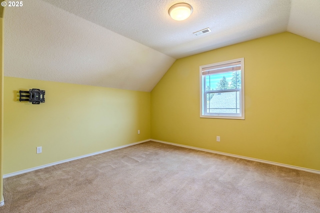 308 SW 38th Loop, Gresham, OR 97080 - bonus room with vaulted ceiling, carpet flooring, and a textured ceiling