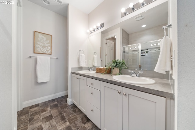 2310 S Heather St, Cornelius, OR 97113 - bathroom with double vanity, a stall shower, and stone finish flooring