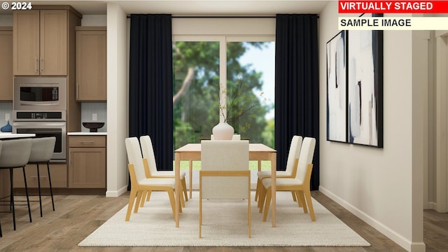 dining space featuring light hardwood / wood-style flooring