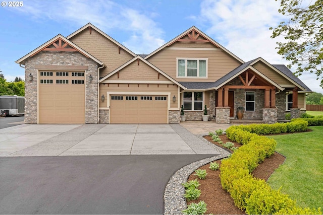10704 NE 189th St, Battle Ground, WA 98604 - craftsman house with stone siding, driveway, an attached garage, and a front yard
