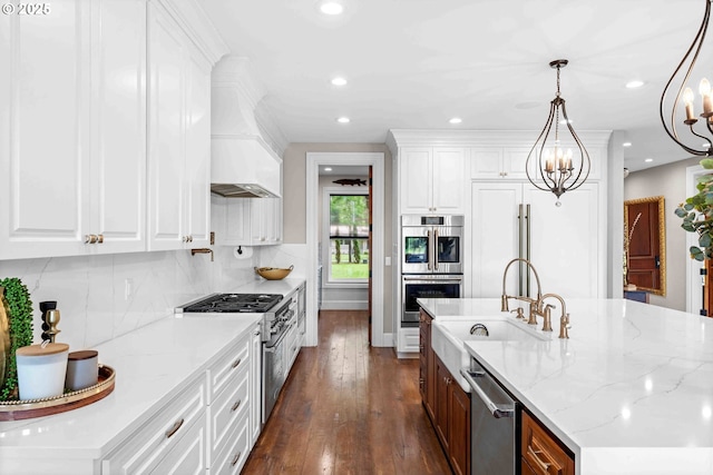 10704 NE 189th St, Battle Ground, WA 98604 - kitchen featuring stainless steel appliances, a sink, custom exhaust hood, dark wood-style flooring, and recessed lighting