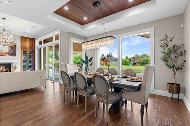 10704 NE 189th St, Battle Ground, WA 98604 - dining space with a chandelier, a raised ceiling, hardwood / wood-style flooring, baseboards, and recessed lighting