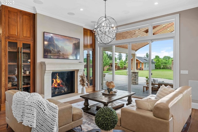 10704 NE 189th St, Battle Ground, WA 98604 - living area featuring ornamental molding, dark wood-style flooring, a chandelier, recessed lighting, and a high end fireplace