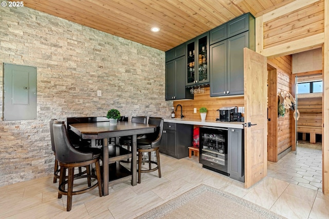 10704 NE 189th St, Battle Ground, WA 98604 - bar area with wine cooler, electric panel, wooden ceiling, a sink, and recessed lighting