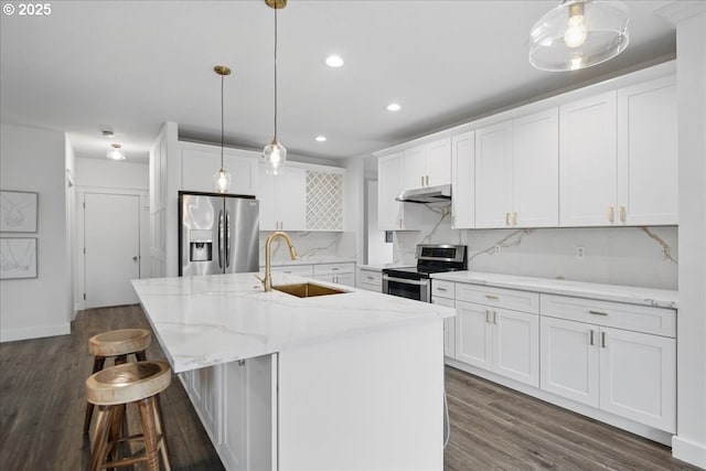 kitchen featuring under cabinet range hood, a sink, white cabinetry, appliances with stainless steel finishes, and backsplash