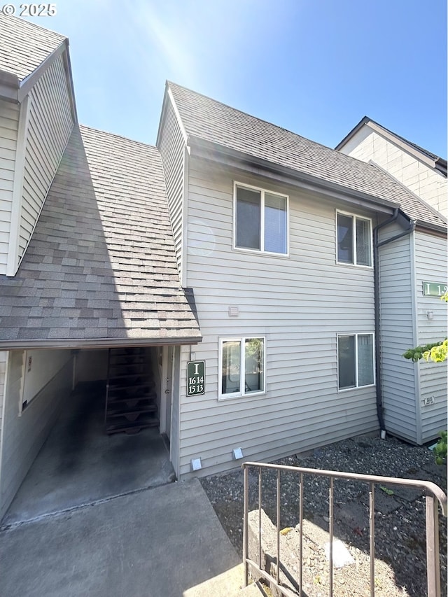 200 SW Florence Ave Unit I 14, Gresham, OR 97080 - view of side of home featuring roof with shingles
