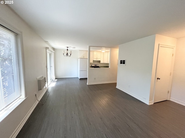 200 SW Florence Ave Unit I 14, Gresham, OR 97080 - unfurnished living room with a chandelier, dark wood-type flooring, and plenty of natural light