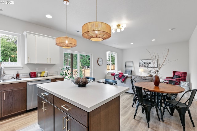 88104 7th St, Veneta, OR 97487 - kitchen with dishwasher, a sink, light countertops, white cabinets, and recessed lighting