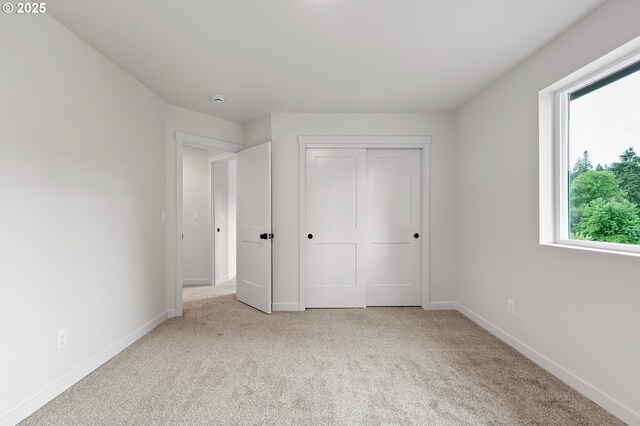 88104 7th St, Veneta, OR 97487 - unfurnished bedroom featuring multiple windows, carpet floors, and baseboards