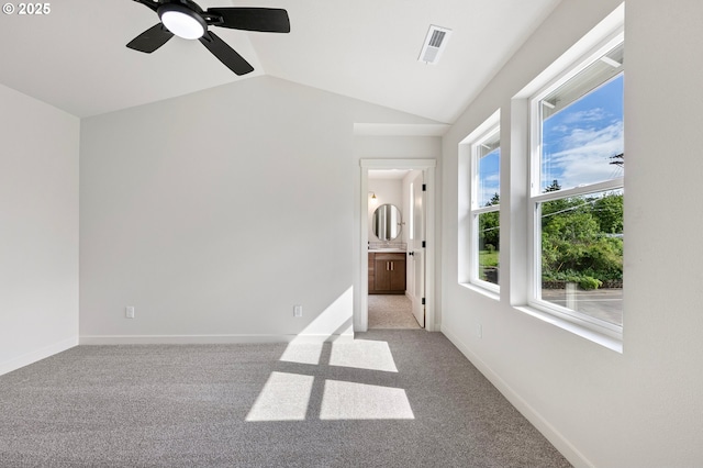 88104 7th St, Veneta, OR 97487 - carpeted empty room featuring vaulted ceiling, a ceiling fan, and baseboards