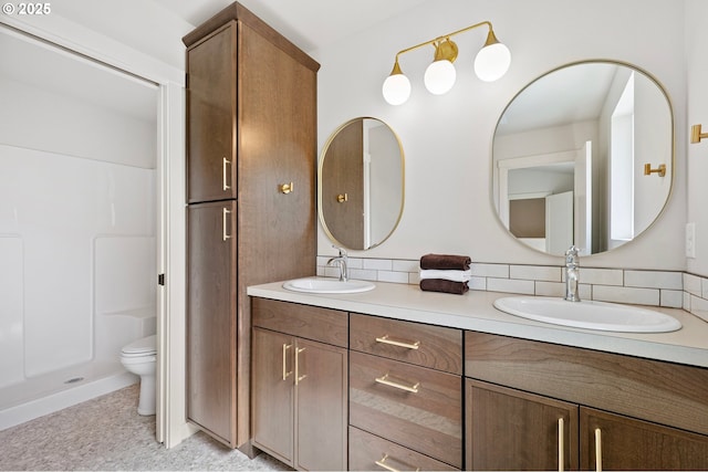 88104 7th St, Veneta, OR 97487 - full bath featuring double vanity, toilet, decorative backsplash, and a shower