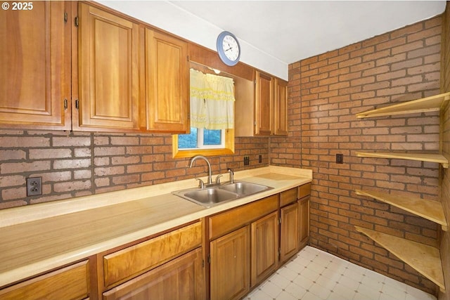 48395 High Leah Dr, Oakridge, OR 97463 - kitchen featuring light countertops, brick wall, and brown cabinets