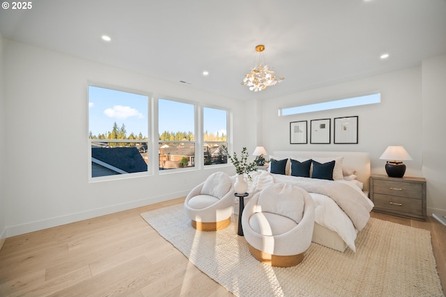 bedroom featuring recessed lighting, wood finished floors, and baseboards