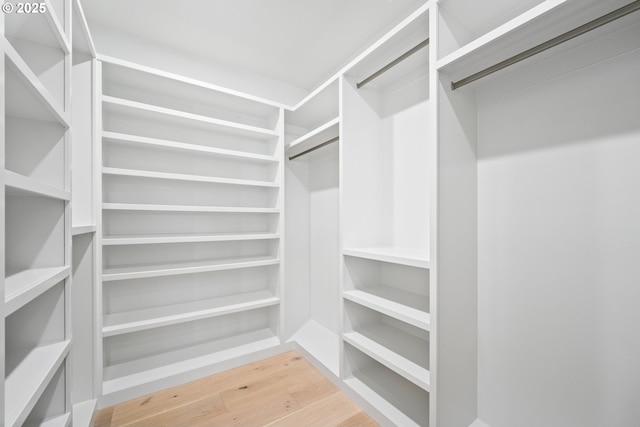 walk in closet featuring light wood-style floors