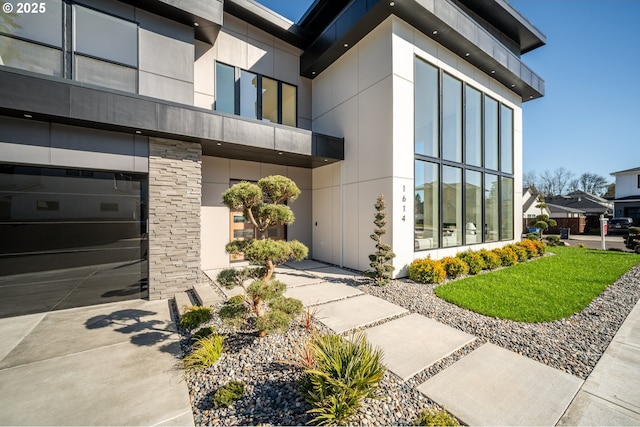 entrance to property featuring stucco siding