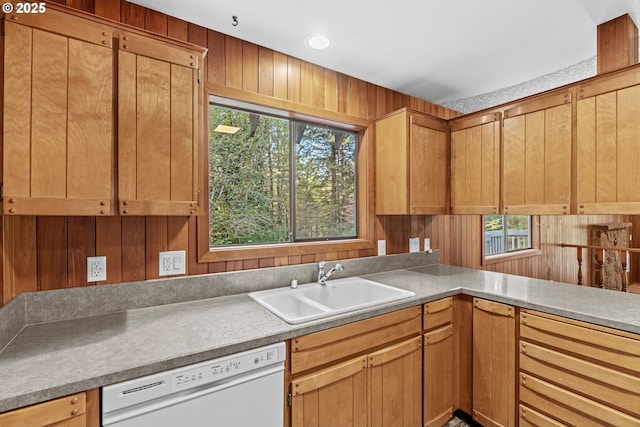 39402 NE 211th Ave, Amboy, WA 98601 - kitchen featuring white dishwasher, a sink, wood walls, and light countertops