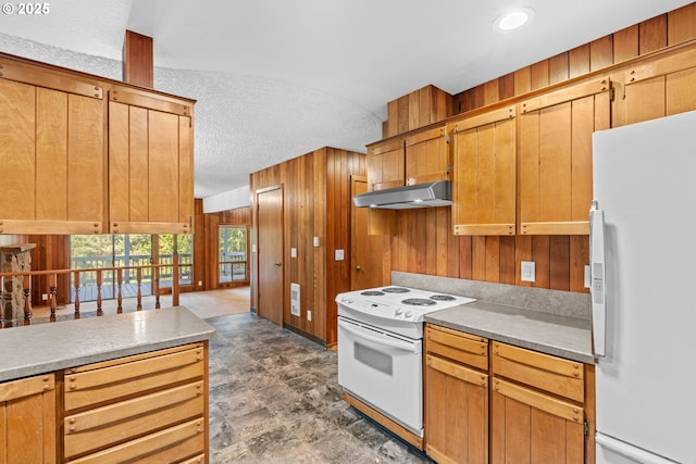 39402 NE 211th Ave, Amboy, WA 98601 - kitchen featuring white appliances, wooden walls, under cabinet range hood, and a textured ceiling