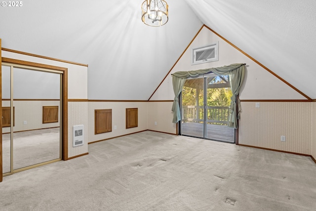 39402 NE 211th Ave, Amboy, WA 98601 - additional living space featuring carpet floors, heating unit, vaulted ceiling, a chandelier, and wallpapered walls