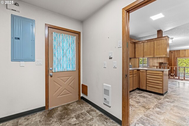 39402 NE 211th Ave, Amboy, WA 98601 - foyer featuring electric panel, baseboards, light stone finish flooring, and heating unit