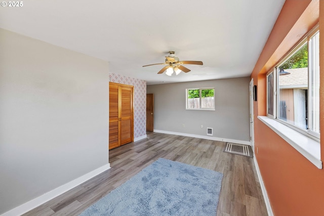 93753 E Mill Ln, Coos Bay, OR 97420 - unfurnished room featuring baseboards, a ceiling fan, and wood finished floors