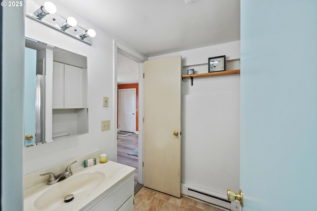 93753 E Mill Ln, Coos Bay, OR 97420 - bathroom featuring a baseboard heating unit and vanity