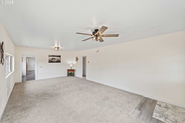 93753 E Mill Ln, Coos Bay, OR 97420 - unfurnished living room with a ceiling fan and baseboards