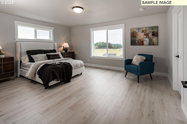 8002 N Haregrave St, Camas, WA 98607 - bedroom featuring light wood-style flooring and baseboards
