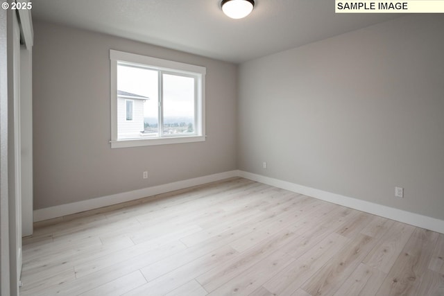 8002 N Haregrave St, Camas, WA 98607 - spare room featuring baseboards and wood finished floors