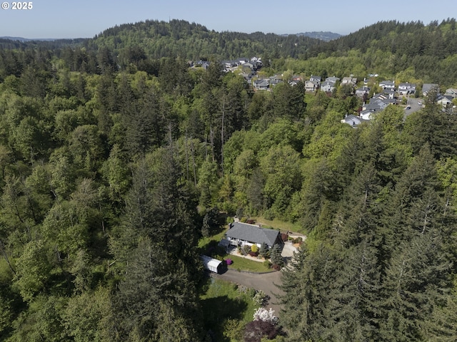 aerial view with a wooded view