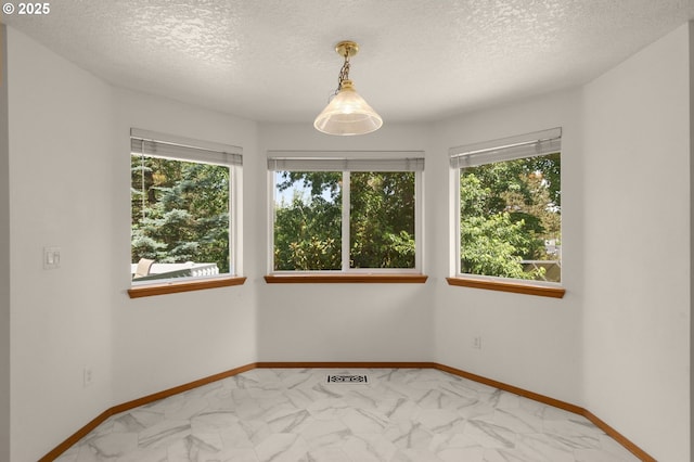 16149 SW Snapdragon Ln, Tigard, OR 97223 - empty room with marble finish flooring and a textured ceiling