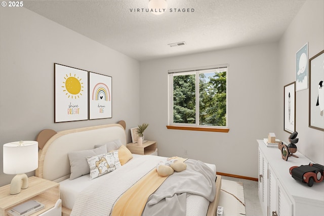 16149 SW Snapdragon Ln, Tigard, OR 97223 - bedroom featuring light colored carpet and a textured ceiling