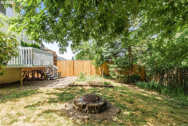 16149 SW Snapdragon Ln, Tigard, OR 97223 - fenced backyard featuring stairs, a fire pit, and a wooden deck