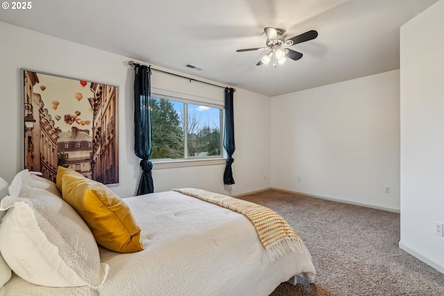 carpeted bedroom featuring baseboards, visible vents, and ceiling fan