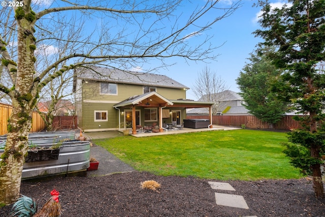 rear view of property with a patio, a lawn, a fenced backyard, and a vegetable garden