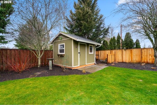 view of shed featuring a fenced backyard