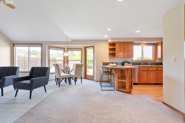 8355 SW 159th Pl, Beaverton, OR 97007 - kitchen with light carpet, open shelves, healthy amount of natural light, and recessed lighting