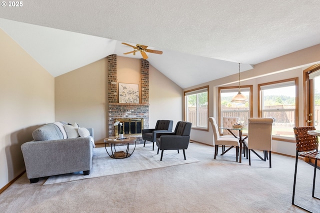 8355 SW 159th Pl, Beaverton, OR 97007 - carpeted living area with ceiling fan, vaulted ceiling, a brick fireplace, a textured ceiling, and baseboards