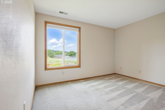 8355 SW 159th Pl, Beaverton, OR 97007 - unfurnished room featuring plenty of natural light, light carpet, and baseboards