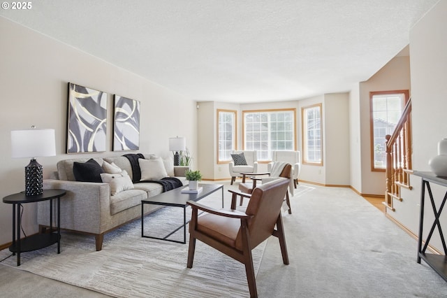 8355 SW 159th Pl, Beaverton, OR 97007 - living area with stairway, carpet flooring, baseboards, and a textured ceiling