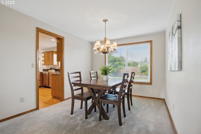 8355 SW 159th Pl, Beaverton, OR 97007 - dining area featuring a chandelier, baseboards, and light carpet