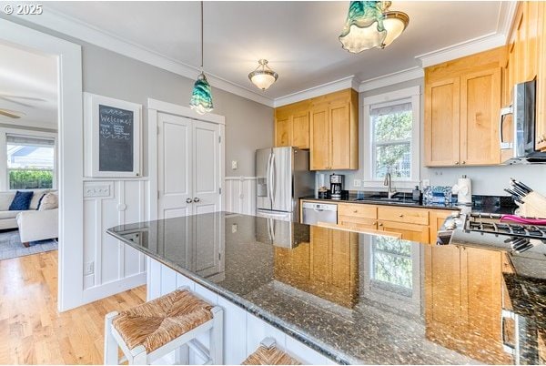 2752 SW Beach Ave, Lincoln City, OR 97367 - kitchen featuring a sink, light wood-style flooring, a wealth of natural light, and appliances with stainless steel finishes