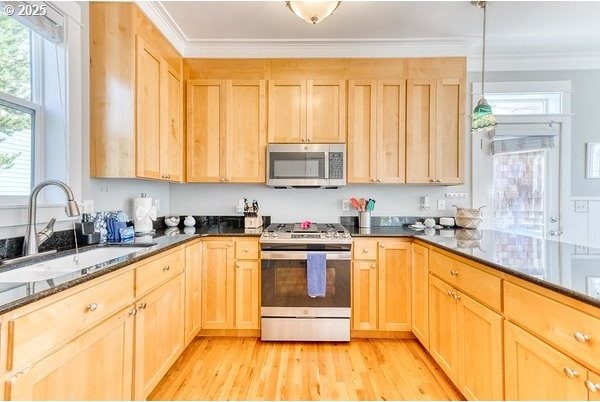 2752 SW Beach Ave, Lincoln City, OR 97367 - kitchen featuring stainless steel appliances, light brown cabinets, and a sink
