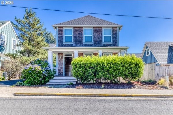 2752 SW Beach Ave, Lincoln City, OR 97367 - traditional home featuring covered porch and fence