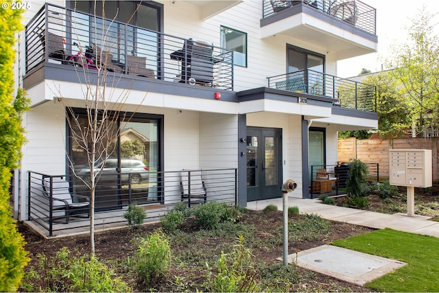entrance to property with a balcony and french doors