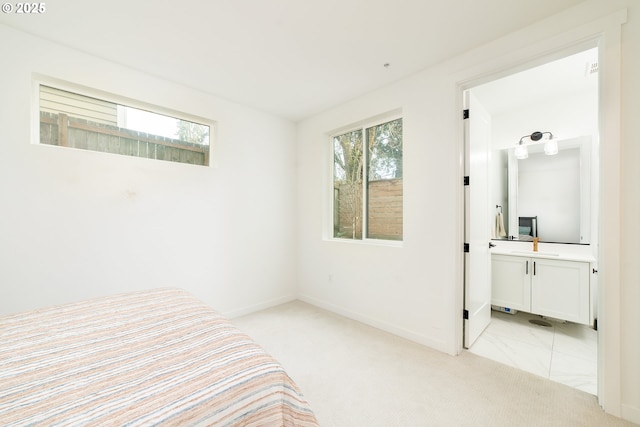 unfurnished bedroom with baseboards and light carpet