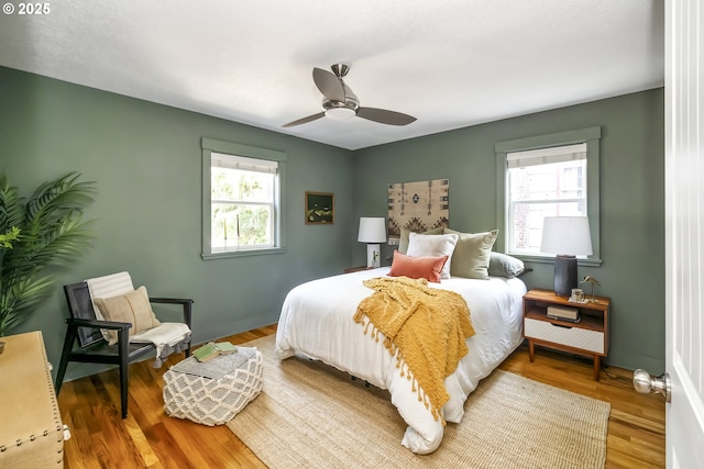 5835 NE 23rd Ave, Portland, OR 97211 - bedroom featuring wood finished floors and a ceiling fan